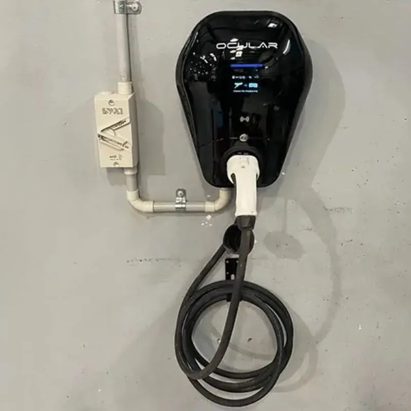 Black Ocular IQ Wallbox 7kW EV charger wall-mounted at an office in Canning Vale, with a coiled Type 2 tethered cable
